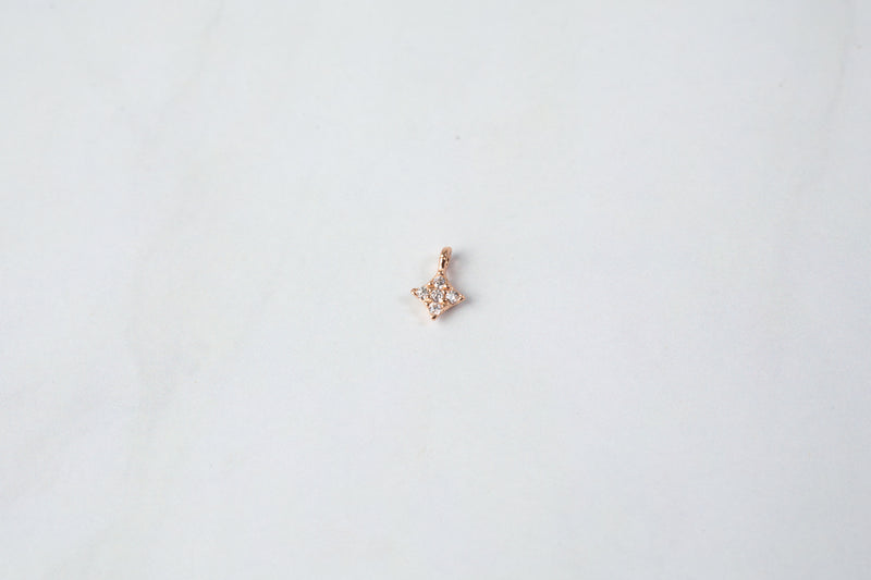 Load image into Gallery viewer, 4mm Sterling Silver Rose 4 Point Star Charm with Cubic Zirconia
