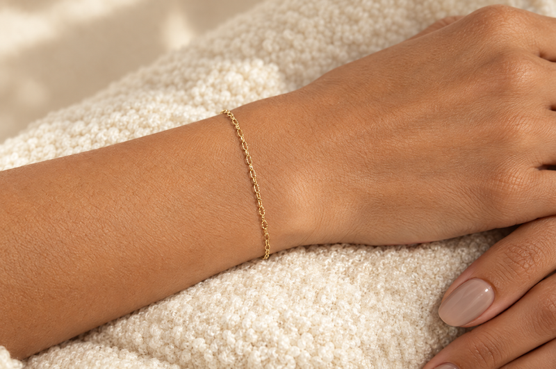 Load image into Gallery viewer, Celeste 2.15mm gold PVD stainless steel textured cable chain worn as a welded permanent bracelet
