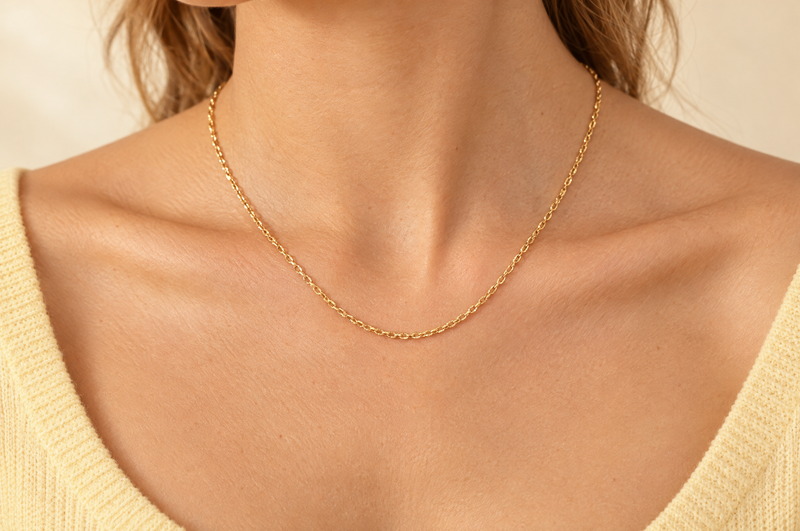 Load image into Gallery viewer, Celeste 2.15mm gold PVD stainless steel textured cable chain worn as a permanent necklace
