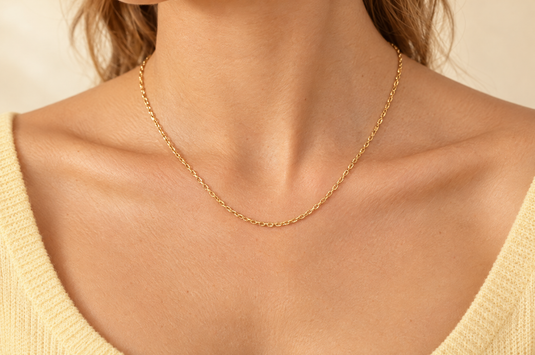 Celeste 2.15mm gold PVD stainless steel textured cable chain worn as a permanent necklace
