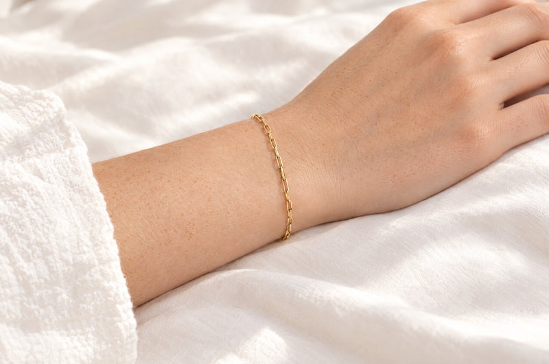 Load image into Gallery viewer, Monica 2.5mm gold PVD stainless steel paperclip chain worn as a welded permanent bracelet

