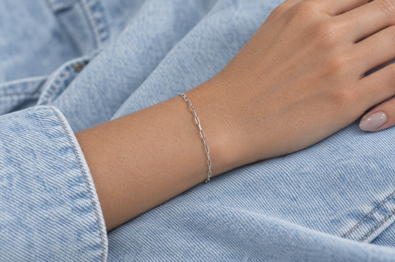 Load and play video in Gallery viewer, Penelope 2.5mm silver-tone stainless steel paperclip chain worn as a welded permanent bracelet, video
