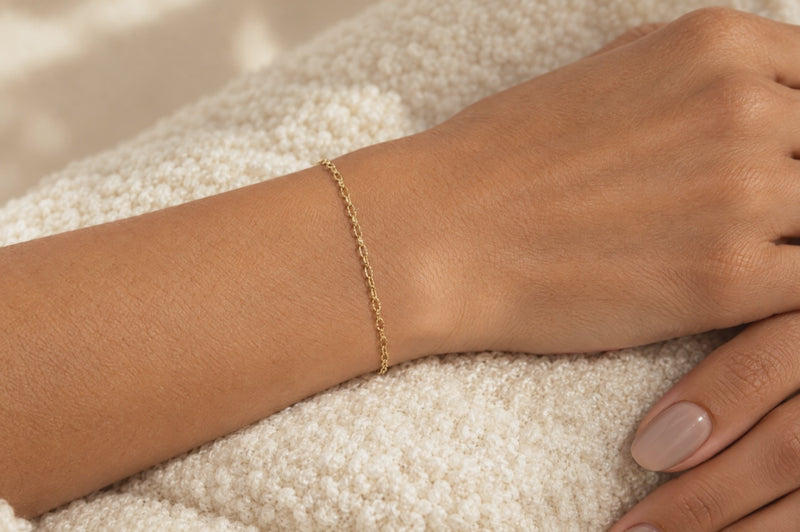 Load and play video in Gallery viewer, Celeste 2.15mm gold PVD stainless steel textured cable chain worn as a welded permanent bracelet, video
