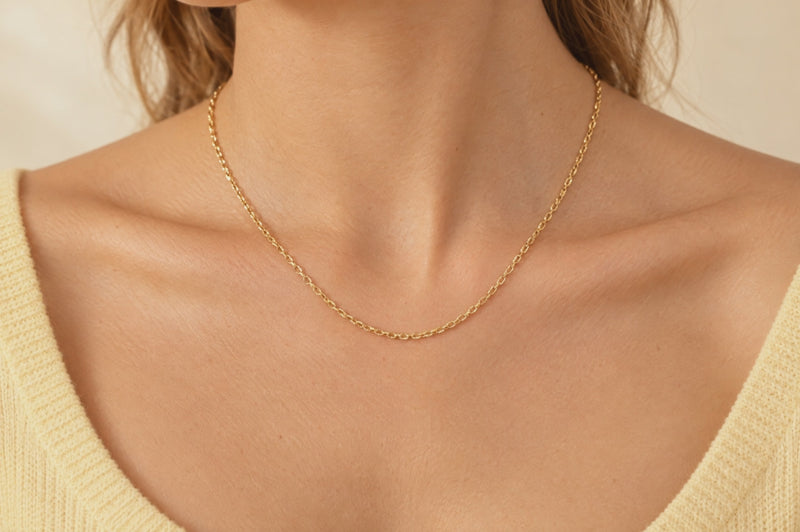 Load and play video in Gallery viewer, Celeste 2.15mm gold PVD stainless steel textured cable chain worn as a permanent necklace, video
