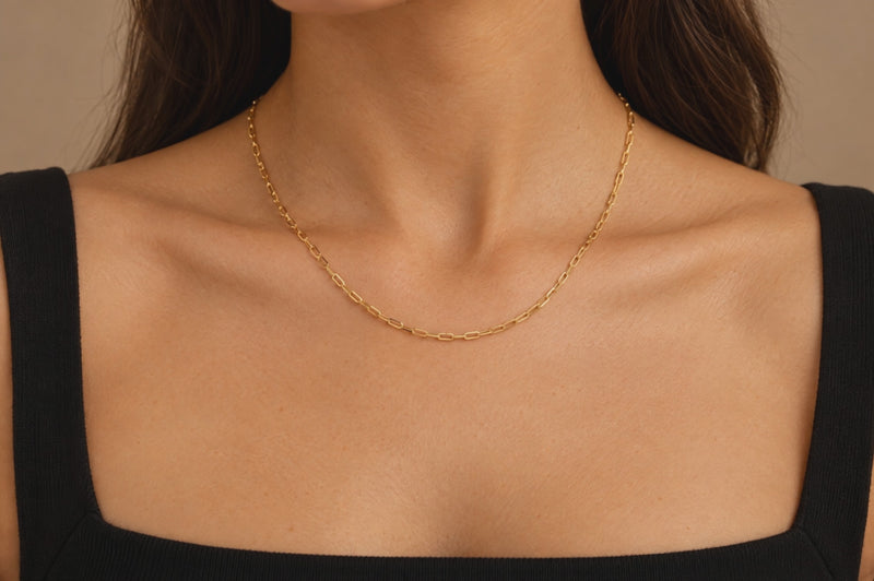Load and play video in Gallery viewer, Monica 2.5mm gold PVD stainless steel paperclip chain worn as a permanent necklace, video
