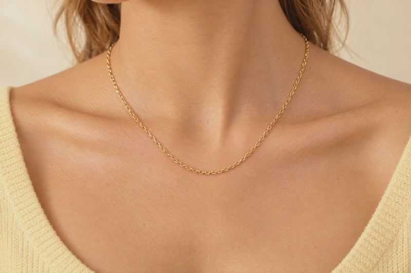 Load and play video in Gallery viewer, Celeste 2.15mm gold PVD stainless steel textured cable chain worn as a permanent necklace, video
