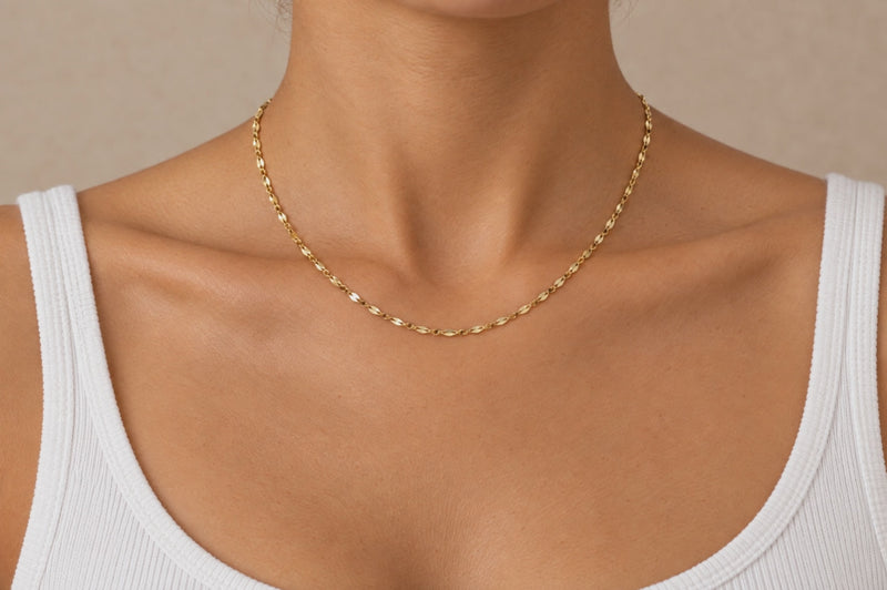 Load and play video in Gallery viewer, Aliana 2mm gold PVD stainless steel flat lip chain worn as a permanent necklace, video
