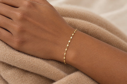 Aliana 2mm gold PVD stainless steel flat lip chain worn as a welded permanent bracelet, video