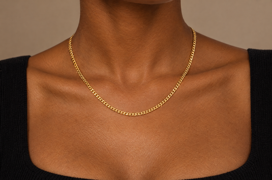 Purrari 2mm gold PVD stainless steel diamond cut curb chain worn as a permanent necklace