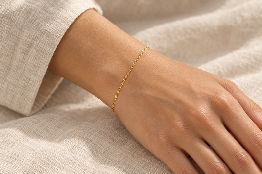 Sol 1.5mm gold PVD stainless steel oval cable chain worn as a welded permanent bracelet