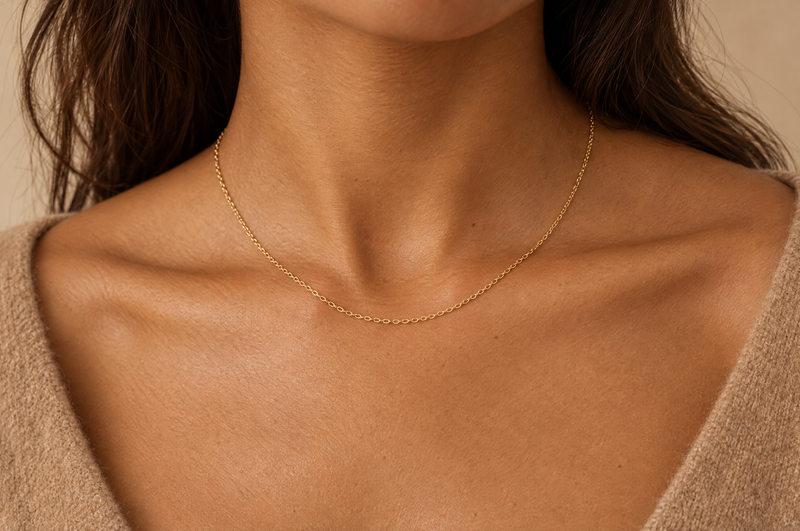 Load image into Gallery viewer, Sol 1.5mm gold PVD stainless steel oval cable chain worn as a permanent necklace
