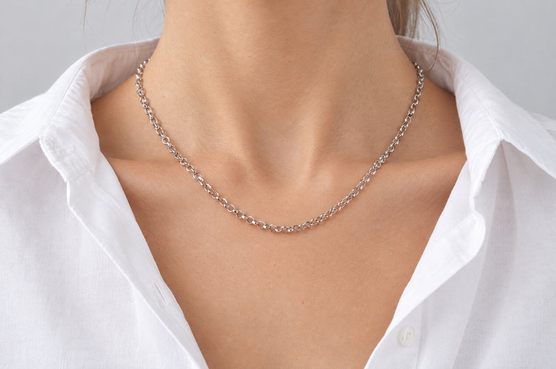 Load image into Gallery viewer, Zara 3mm silver-tone stainless steel cable chain worn as a permanent necklace
